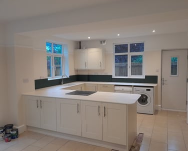 a freshly painted kitchen in Bournemouth with a washing machine