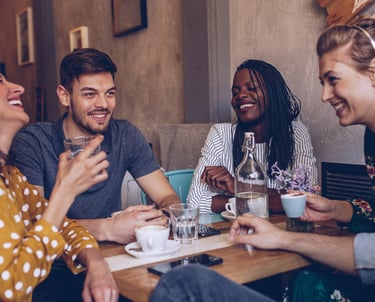 a group of friends having a conversation and connnecting at a restaurant