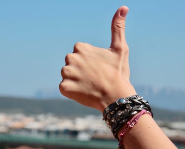 photo of a thumb up with a blue background