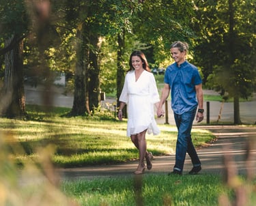 Man and woman holding hands walking