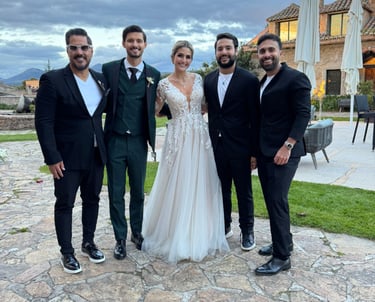 a bride and groomsmen posing for a photo