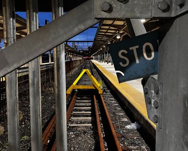 a stop sign on a railroad track