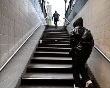 a man in a black jacket and a woman in a black jacket