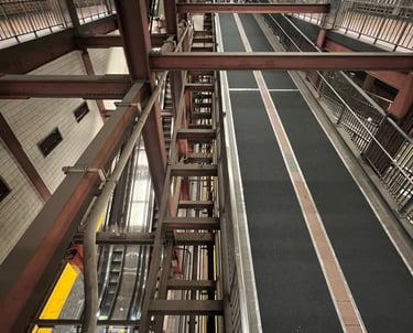 a train station with a train on the tracks