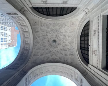 a view of a building with a sky view of a city