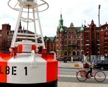 a large buoy in the center of Hamburg traffic