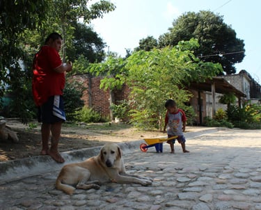 a man plays with his son in the streets of Puerto Vallarta