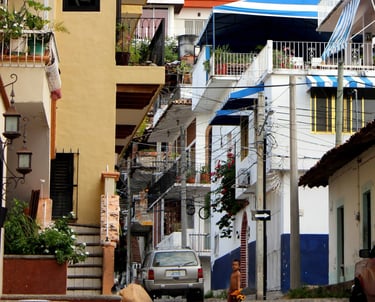 a street scene of Puerto Vallarta with boy and toy
