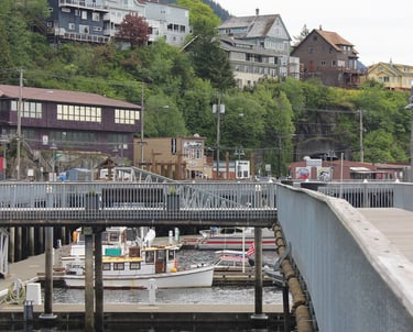 a bridge over a river with a boat in the water