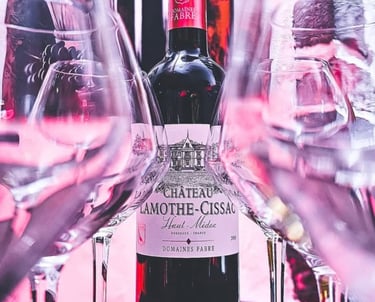 a bottle of wine with a bottle of wine in front of a wine glass