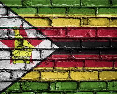 Image of Zimbabwean flag painted on brick wall