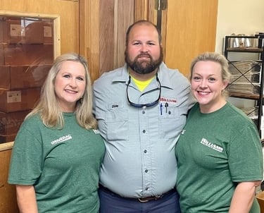 Williams Family-Mother, Son and Daughter standing together in the office