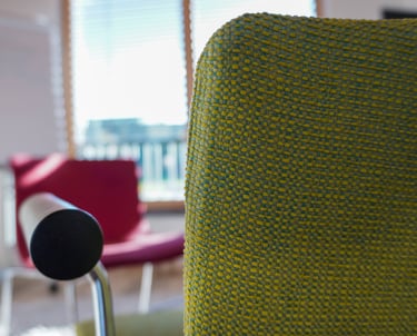 a chair with a microphone and a chair with a microphone