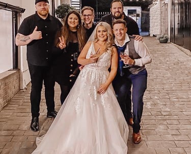 a bride and groom pose for a photo in a wedding photo