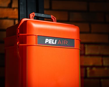 a red suitcase with a pelican air