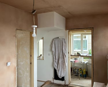 Stairs in, plastering done, new radiator under protection!