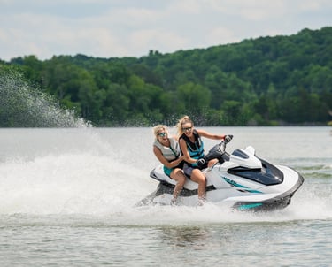 a woman riding a jet ski in the water