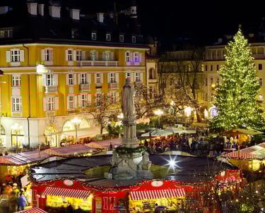 Walther Square in Bolzano with Christmas tree, festive stalls, and holiday lights