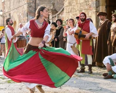 Medieval dancer at the Monteriggioni Medieval Festival with musicians and performers in period costu