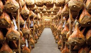 Prosciutto Veneto DOP hams aging in Montagnana, traditional cured ham from Veneto Italy