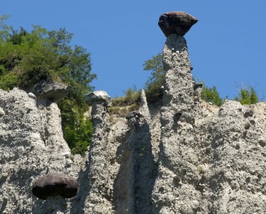 Earth Pyramids of Zone, tall stone spires capped with boulders near Lake Iseo