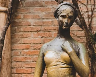 Juliet statue in Verona’s courtyard, famous for visitors touching her right breast for good luck