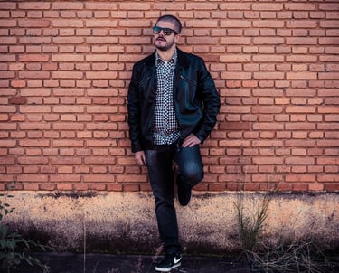 Joe Cruciti wearing sunglasses in a horizontal professional promo photo