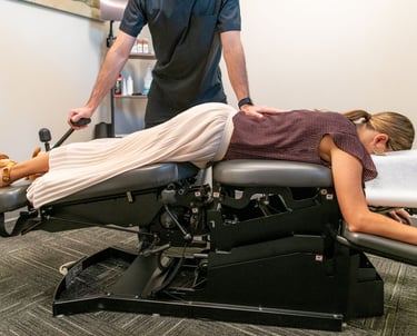 a woman is getting a chiropractic adjustment