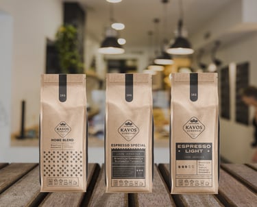 three coffee bags , ckaft color and black design