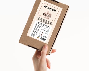 hand holding craft box with colored home scent label