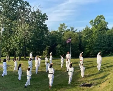 Students training karate outside