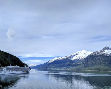 skagway Alaska mountains with cruise ship on water