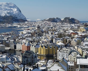 city of alesund Norway with mountains in background