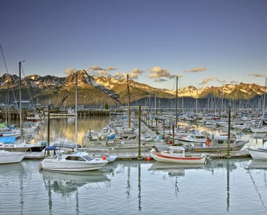 Seward Alaska Marina with boats and mountains in distance