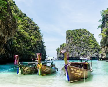 Ships in blue water near Phuket Thailand