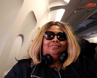 Iolande V Argent on a plane