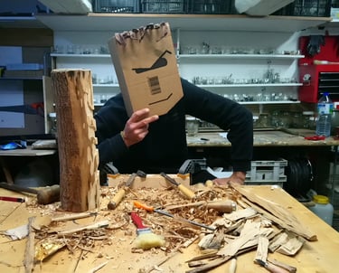 a man in a brown paper bag with a cardboard bag on it
