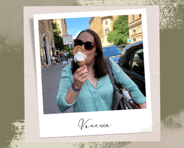 a woman in sunglasses and sunglasses eating a donut