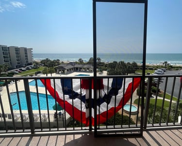 Oceanfront condo with screened in enclosure.