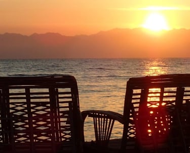 Bedouin star sunrise watching from chairs of the beach in Ras shitan Egypt