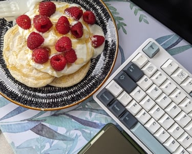 a plate with a plate of food and a laptop