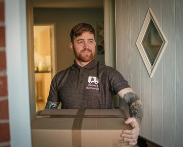 dean at deanos removals carrying a box