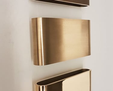 a set of three metal wall mounted shelves