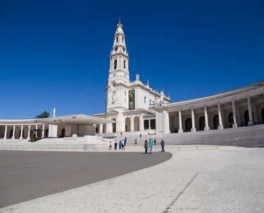 a church with a clock tower in the background