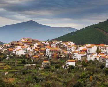 a mountaintop with a view of a village