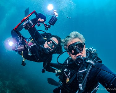 two people are scubaking in the water
