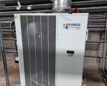 Maxx Cold split cooling unit mounted in a refrigerated storage room, providing precise temperature