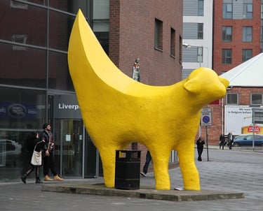 a large yellow banana banana peely dog statue