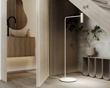 Modern minimalist interior design featuring a sleek wooden staircase with a built-in under-stair storage unit. The area inclu