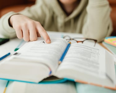 Photo by Photo By: Kaboompics.com: https://www.pexels.com/photo/close-up-of-a-person-reading-6958557